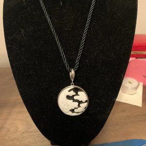 Unique carved moon and clouds pendant on black cord